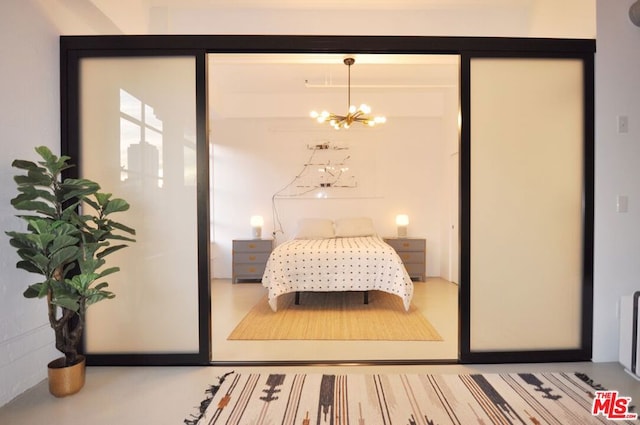 bedroom with an inviting chandelier