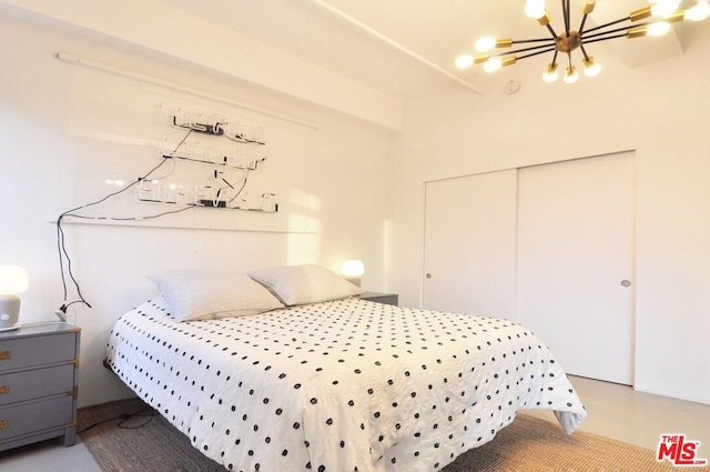 bedroom with a chandelier and a closet