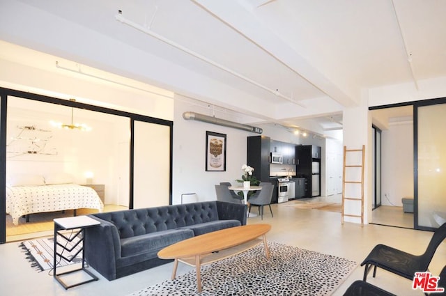 living room with an inviting chandelier