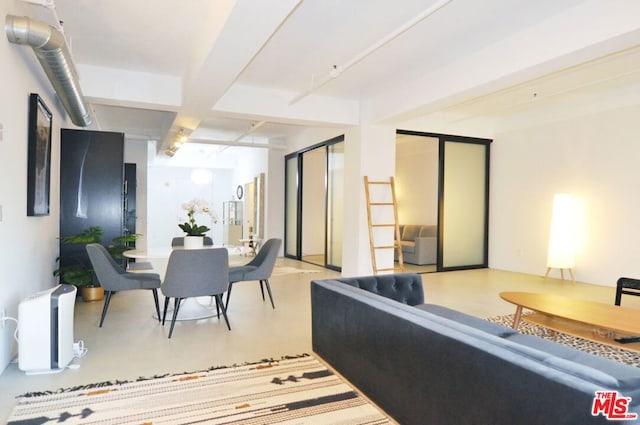 living room with beam ceiling