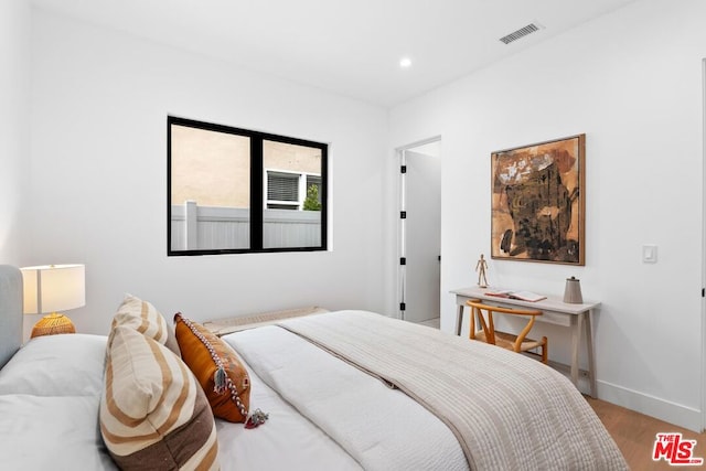 bedroom with light wood-type flooring