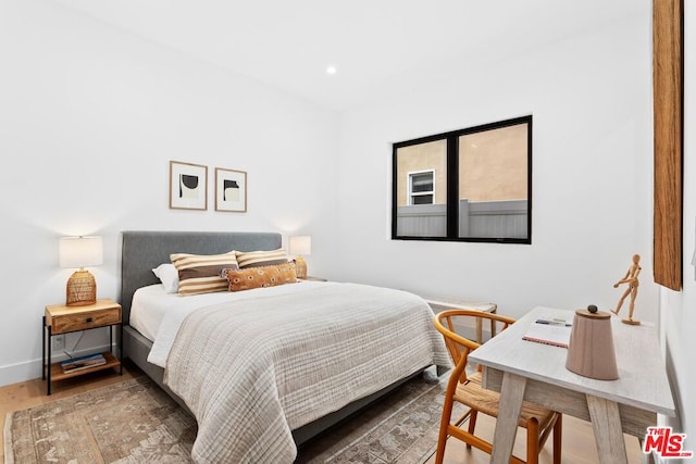 bedroom featuring hardwood / wood-style flooring