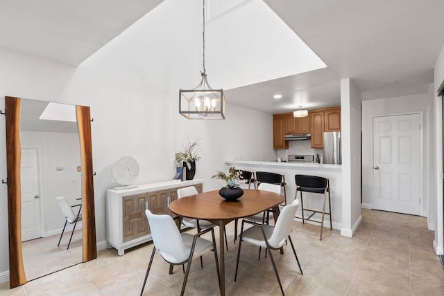 dining area with a notable chandelier