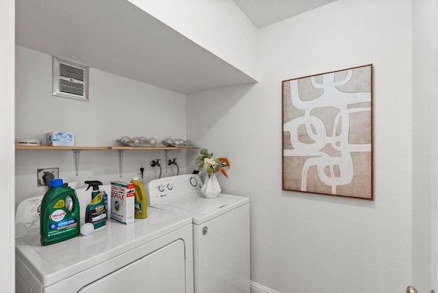 clothes washing area featuring washing machine and clothes dryer