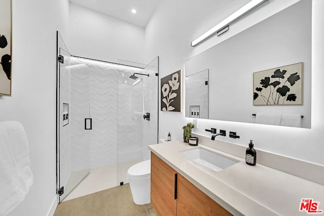 bathroom featuring an enclosed shower, tile patterned floors, vanity, and toilet