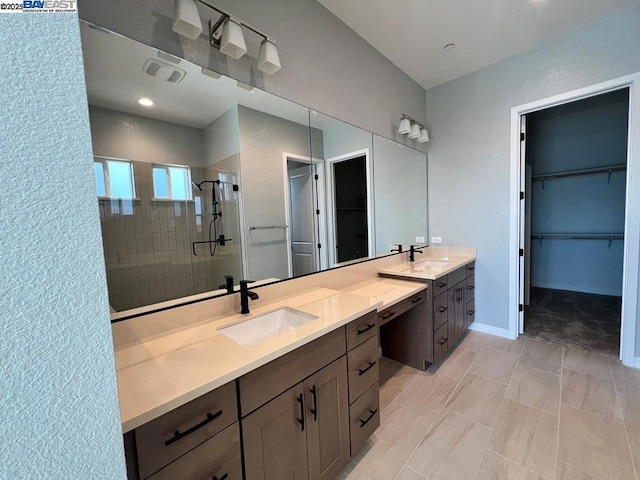 bathroom with vanity and an enclosed shower