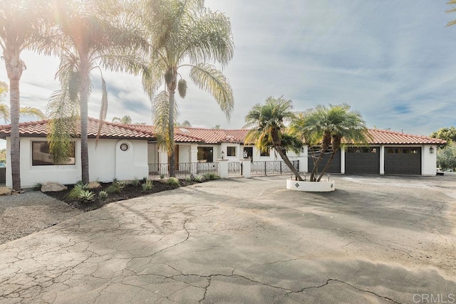 mediterranean / spanish house featuring a garage