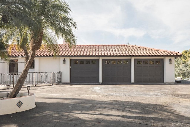 garage with concrete driveway