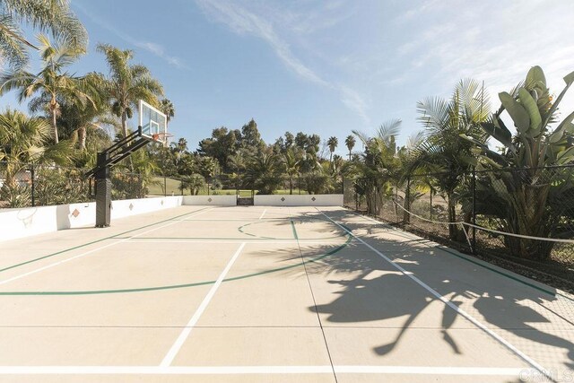 view of sport court featuring fence and community basketball court
