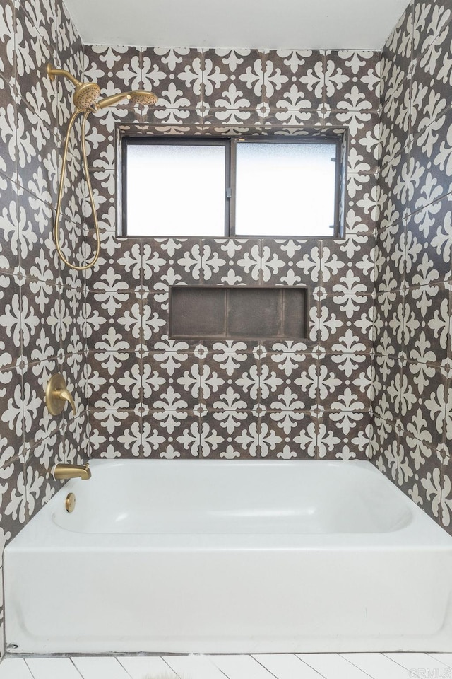 full bathroom with plenty of natural light, shower / bath combination, and wallpapered walls