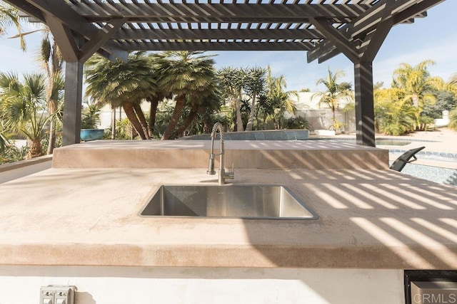 exterior space featuring a sink and a pergola