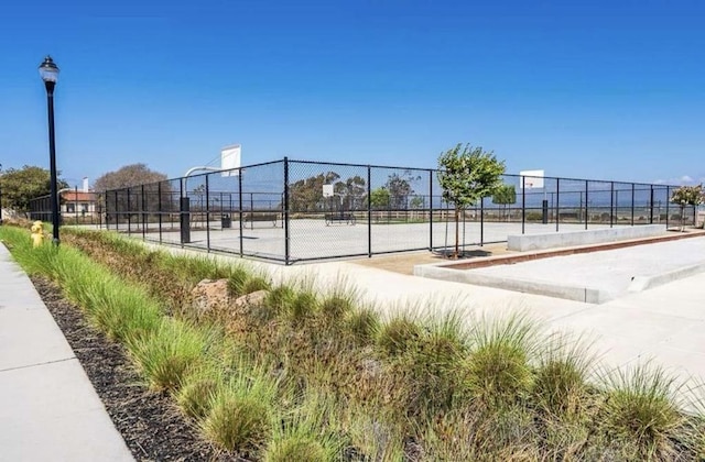 view of home's community with basketball court