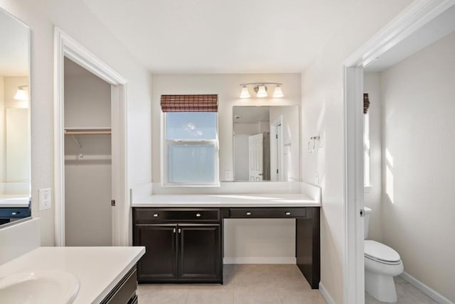 bathroom featuring vanity, toilet, and tile patterned floors