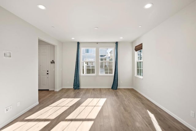 unfurnished room with light hardwood / wood-style flooring