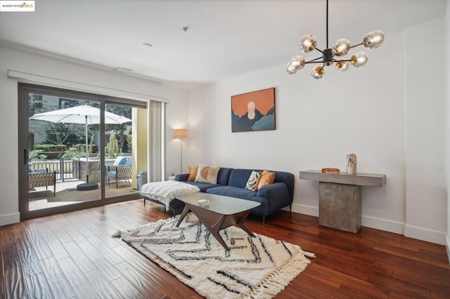 living room featuring dark hardwood / wood-style flooring and a notable chandelier