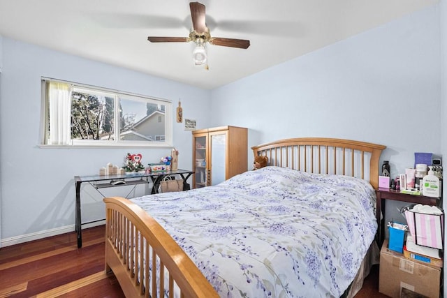 bedroom featuring ceiling fan and dark hardwood / wood-style flooring