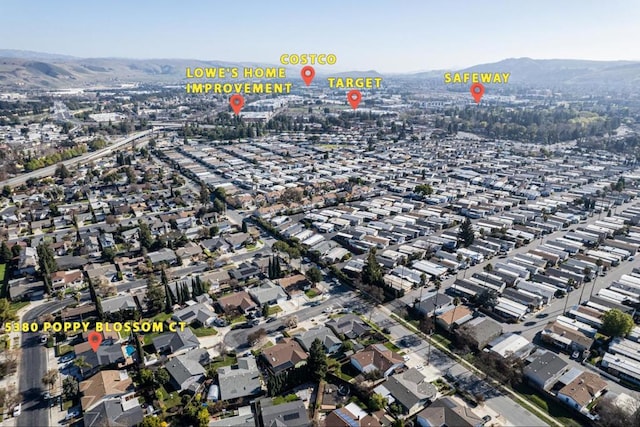 drone / aerial view featuring a mountain view