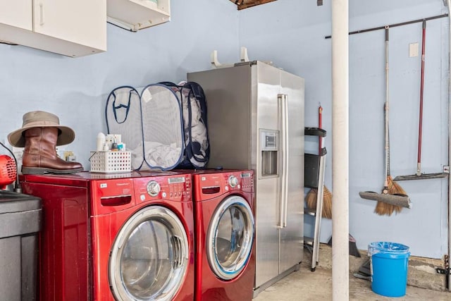 clothes washing area with washing machine and clothes dryer