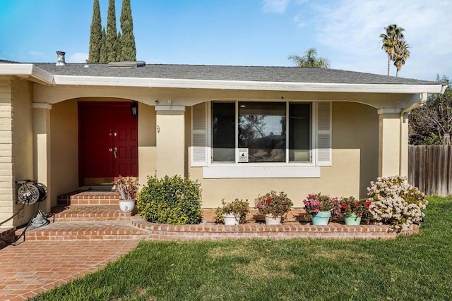 property entrance with a yard