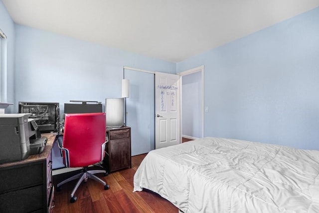 bedroom featuring dark hardwood / wood-style flooring