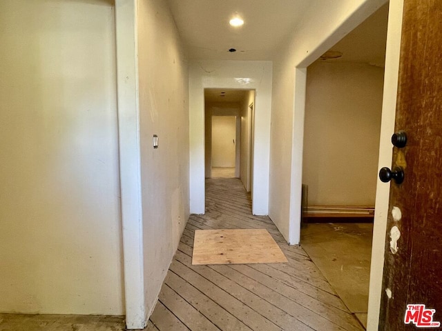 corridor with light wood-type flooring