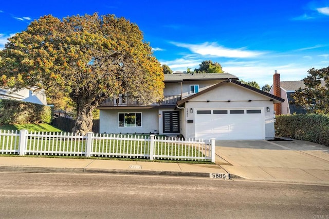 front of property with a garage and a front yard