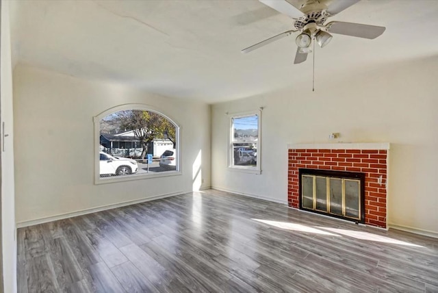 unfurnished living room with wood-type flooring and a fireplace