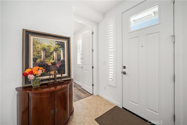 foyer featuring light tile patterned flooring