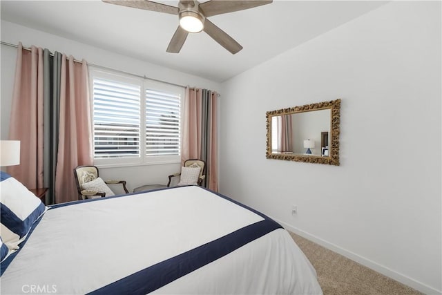 bedroom featuring ceiling fan and carpet