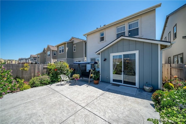 rear view of property with a patio area