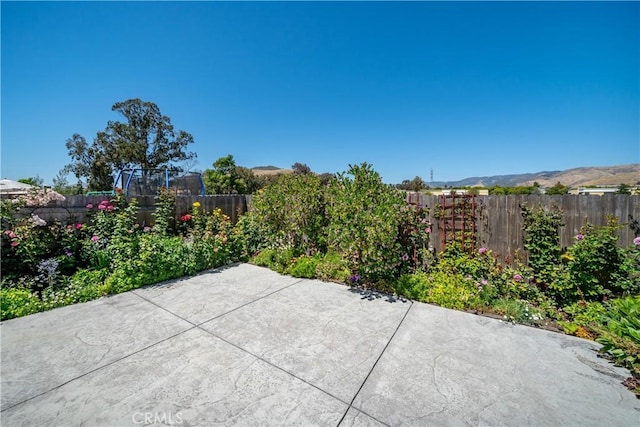 view of patio / terrace with a mountain view