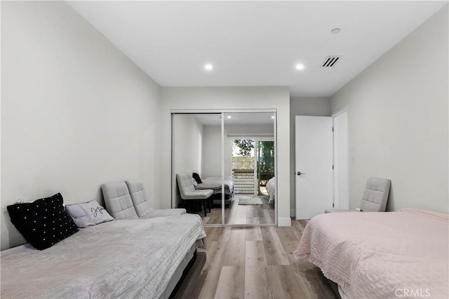 bedroom with a closet and light wood-type flooring