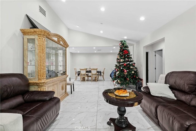 living room featuring lofted ceiling