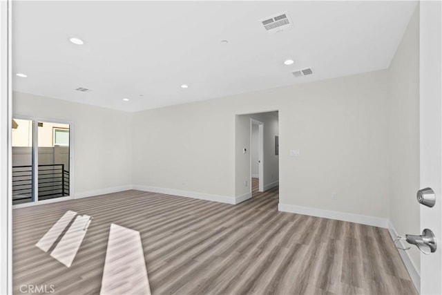 empty room with light hardwood / wood-style floors