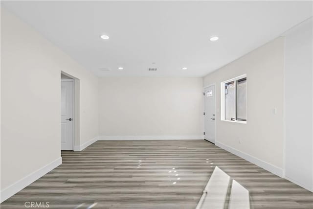 unfurnished room featuring hardwood / wood-style floors