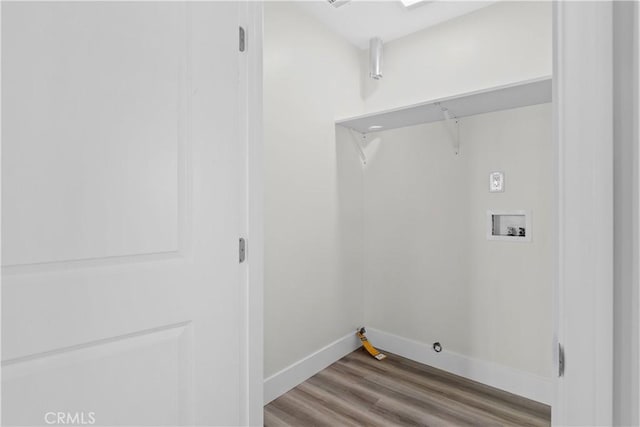 laundry room with hookup for a gas dryer, hookup for a washing machine, and light hardwood / wood-style floors