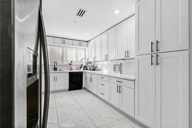 kitchen featuring dishwasher, white cabinetry, sink, backsplash, and stainless steel fridge