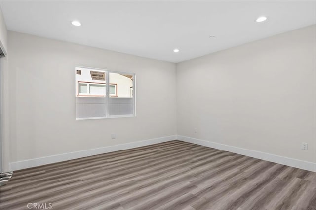 unfurnished room featuring hardwood / wood-style floors