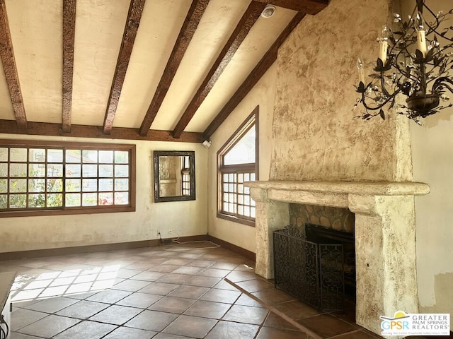 unfurnished living room featuring lofted ceiling with beams and a fireplace