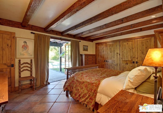 tiled bedroom with access to exterior and beamed ceiling