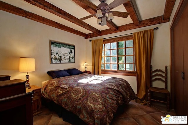 bedroom featuring a closet, beam ceiling, and ceiling fan