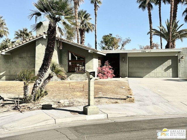 single story home featuring a garage