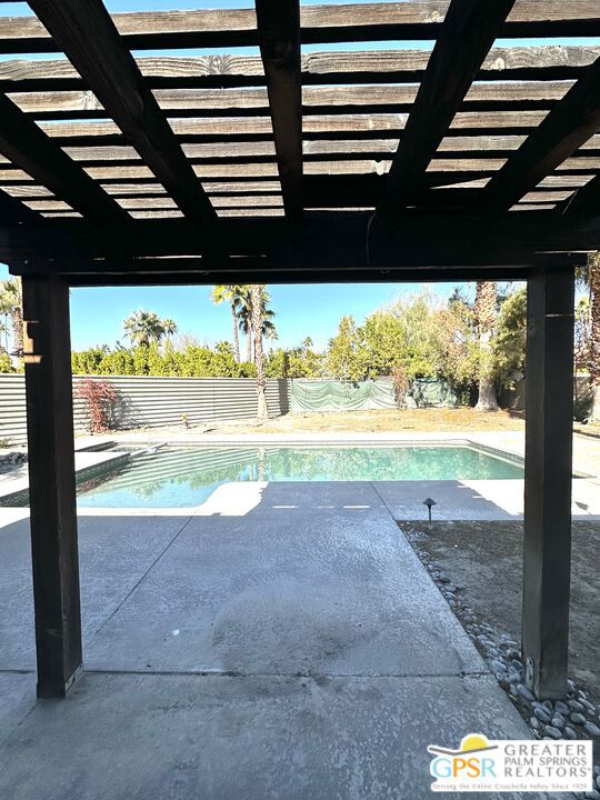 view of pool with a patio area and a pergola