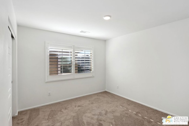 view of carpeted spare room