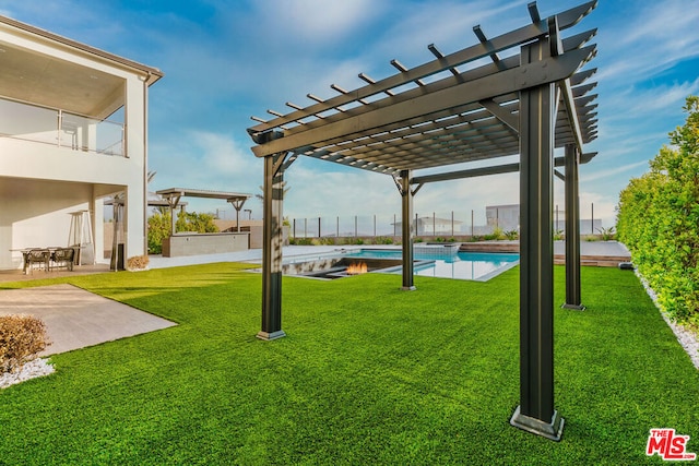 view of yard with a pergola and a patio