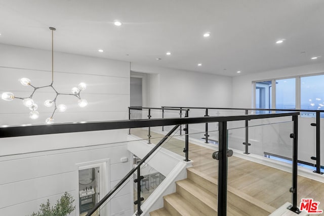 stairs with hardwood / wood-style floors