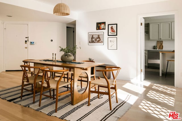 dining space featuring light wood-type flooring