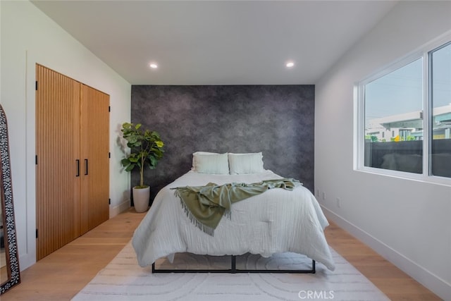 bedroom with light hardwood / wood-style flooring