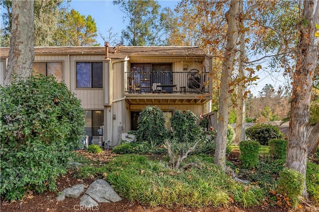 rear view of property with a balcony