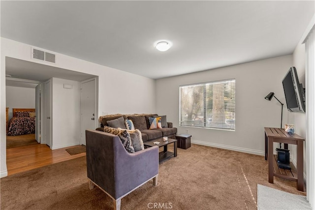 living room featuring light carpet